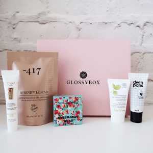 Beauty products in front of a glossybox beauty box