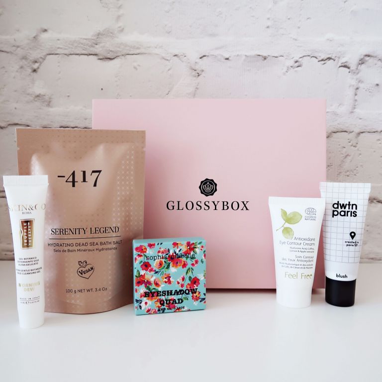 Beauty products in front of a glossybox beauty box 