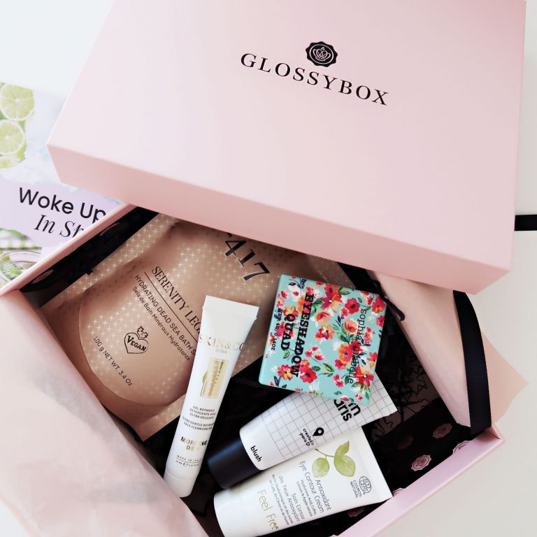 Beauty products inside a bglossybox beauty box with the lid off