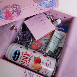 10th Birthday Edition Glossybox: selection of beauty products sat inside a beauty box with the lid placed across one side